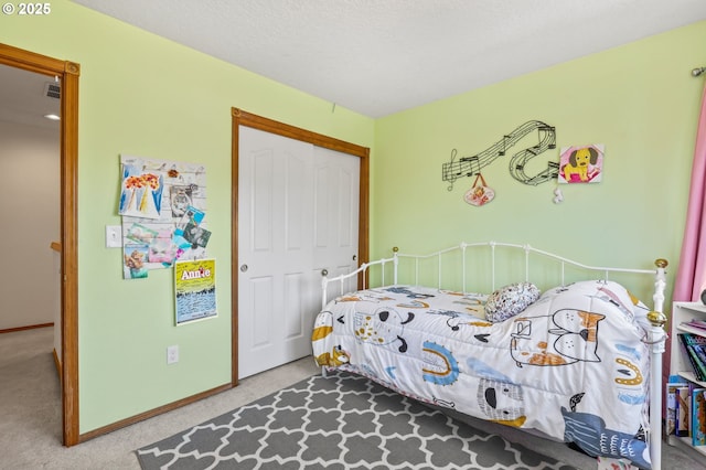 bedroom with carpet floors and a closet