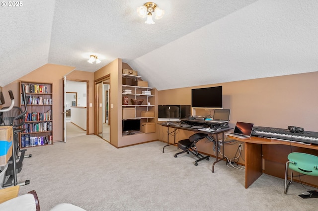 office area featuring vaulted ceiling, a textured ceiling, and carpet floors