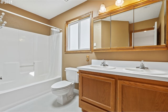 bathroom featuring toilet, double vanity, and shower / bath combo