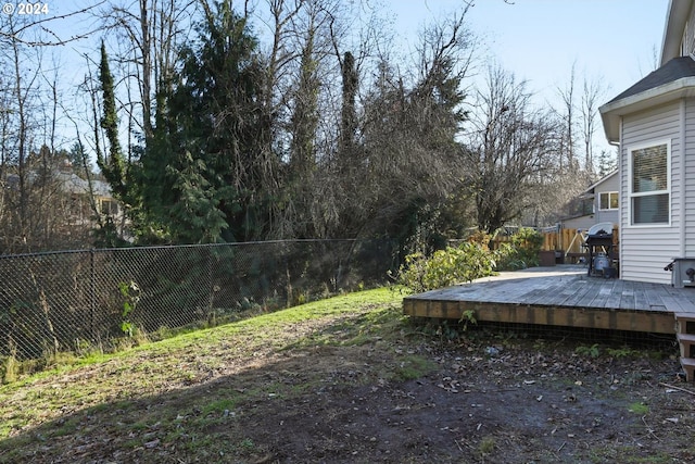 view of yard featuring a wooden deck