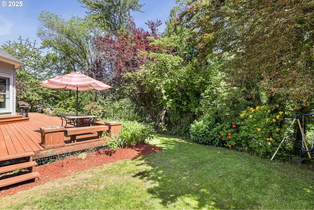 view of yard with a wooden deck