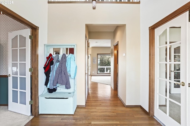 interior space with french doors and wood-type flooring