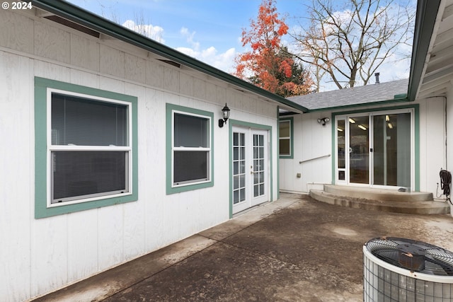 exterior space with central AC and french doors