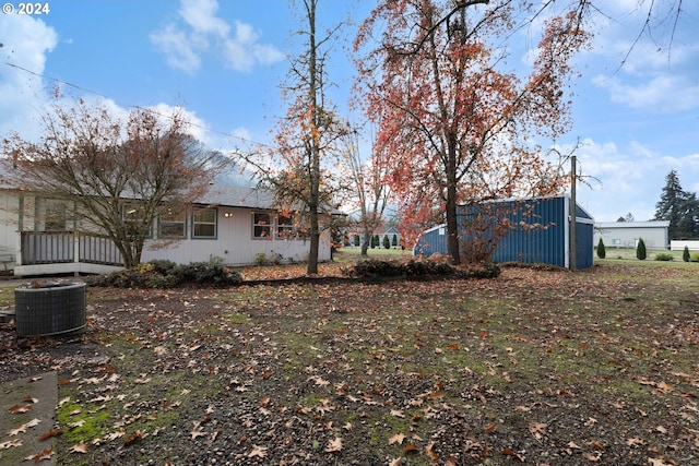 view of yard with central air condition unit