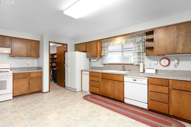 kitchen with white appliances and sink