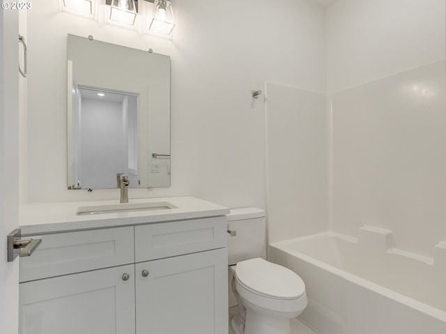 bathroom featuring toilet, shower / tub combination, and vanity