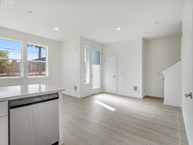 kitchen featuring dishwasher and light wood-type flooring