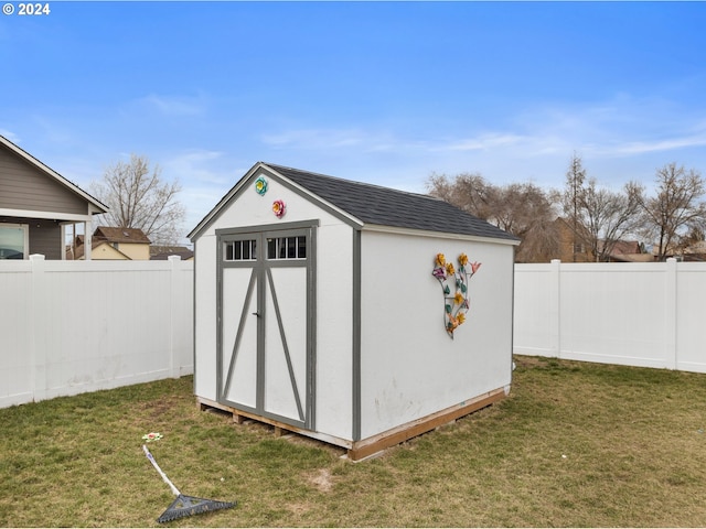 view of outdoor structure with a yard