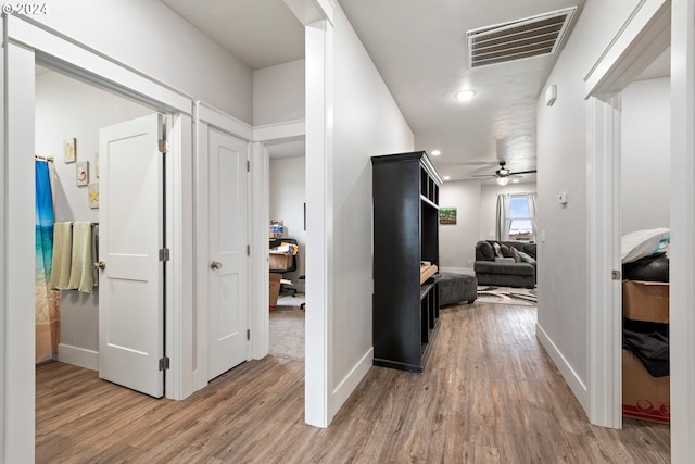 hallway featuring light hardwood / wood-style flooring