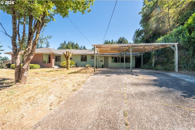 view of front of home with a carport