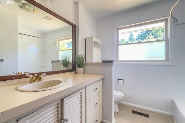 full bathroom with tile patterned floors, bathing tub / shower combination, vanity, and toilet