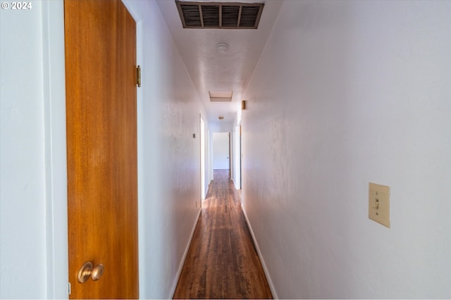 corridor featuring hardwood / wood-style floors