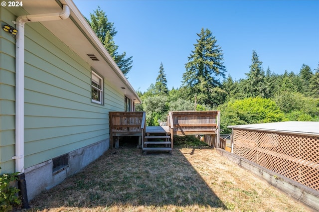 view of yard featuring a deck