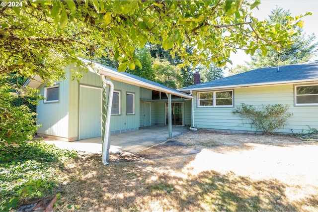 back of property with a patio area