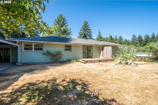 ranch-style home featuring a front yard