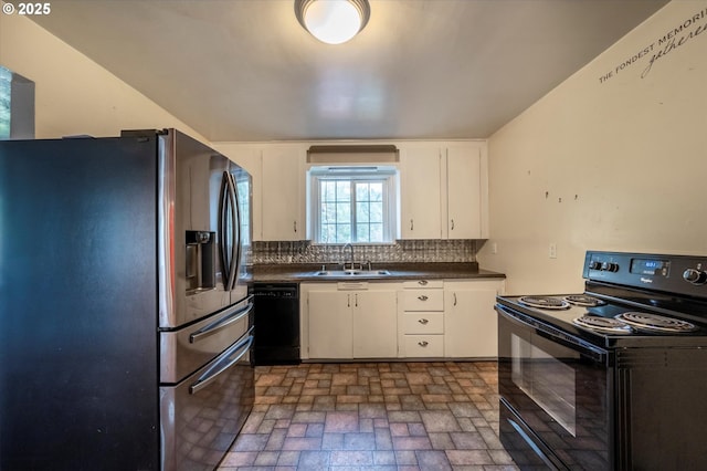 680 NE Laurance St, Myrtle Creek, OR 97457 - kitchen with black appliances, dark countertops, backsplash, white cabinetry, and brick patterned flooring