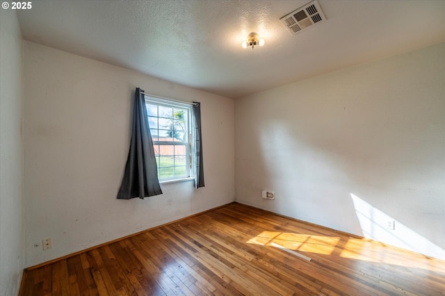 680 NE Laurance St, Myrtle Creek, OR 97457 - spare room with hardwood / wood-style flooring