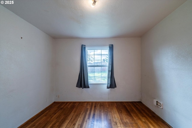 680 NE Laurance St, Myrtle Creek, OR 97457 - spare room featuring hardwood / wood-style flooring and baseboards