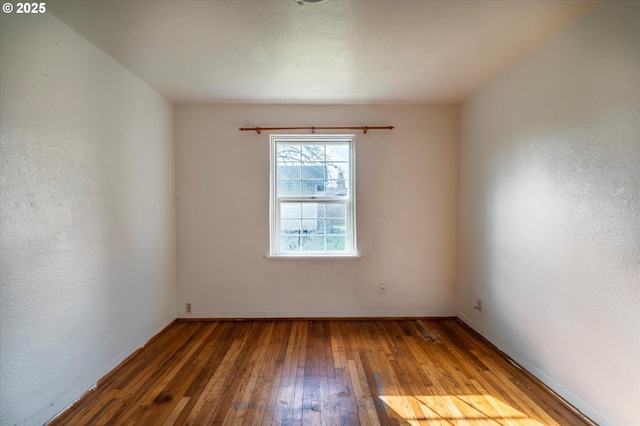 empty room featuring hardwood / wood-style floors