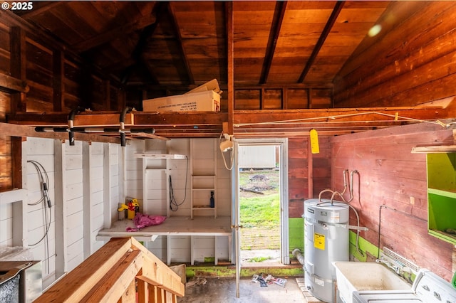 miscellaneous room featuring secured water heater, wood ceiling, wooden walls, washer / clothes dryer, and vaulted ceiling