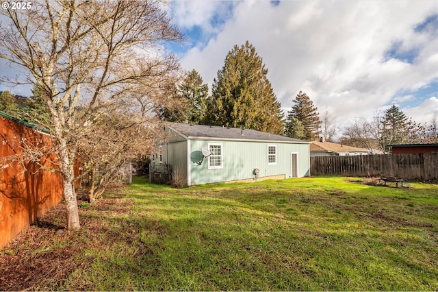 680 NE Laurance St, Myrtle Creek, OR 97457 - back of house featuring a fenced backyard and a fire pit