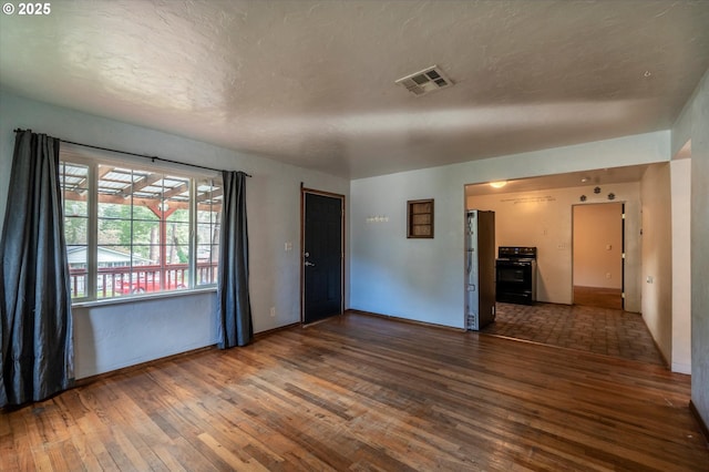 680 NE Laurance St, Myrtle Creek, OR 97457 - spare room featuring hardwood / wood-style flooring and baseboards