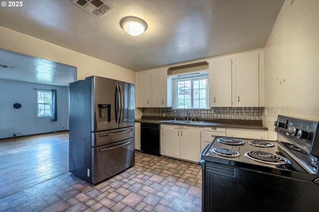 kitchen with decorative backsplash, sink, white cabinets, and black appliances