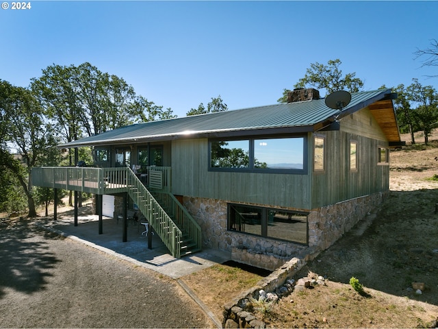 view of front of house with a wooden deck