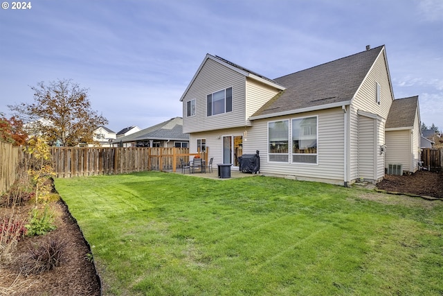 back of house featuring a patio, a yard, and cooling unit