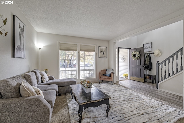 41637 NW Buckshire St, Banks, OR 97106 - living room with a textured ceiling, stairway, and wood finished floors