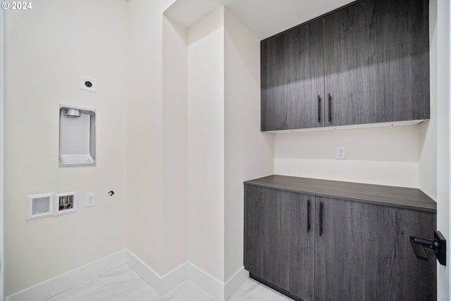 washroom featuring marble finish floor, washer hookup, cabinet space, and hookup for an electric dryer