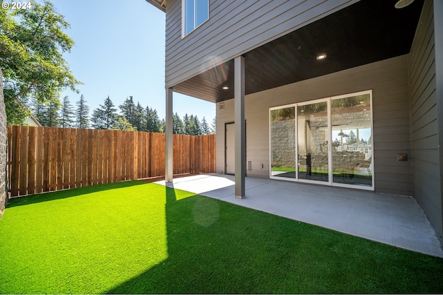 view of yard featuring a patio area and a fenced backyard