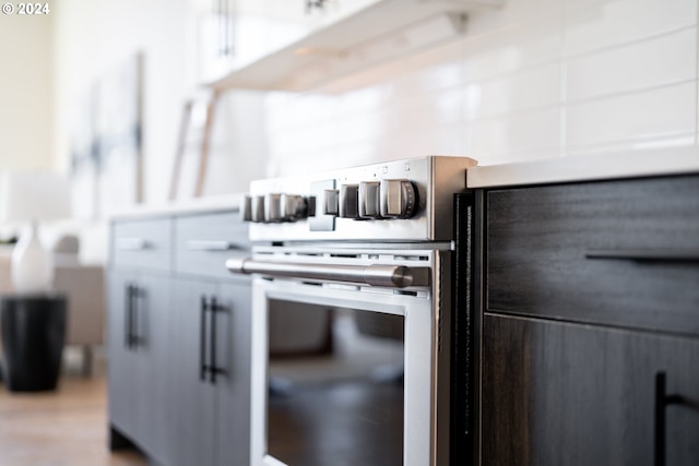 kitchen featuring white cabinets and stainless steel range oven