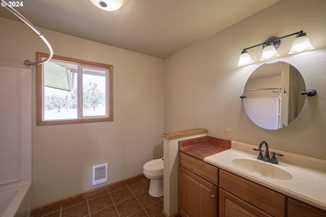 bathroom featuring visible vents, baseboards, toilet, tile patterned flooring, and vanity