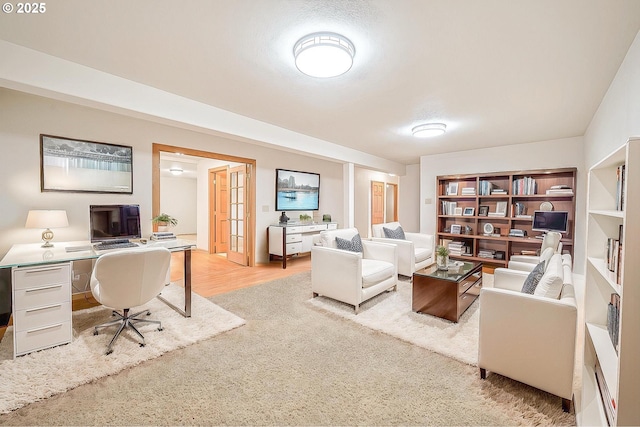 office area featuring light wood-type flooring and french doors