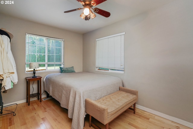 bedroom featuring ceiling fan and light hardwood / wood-style flooring