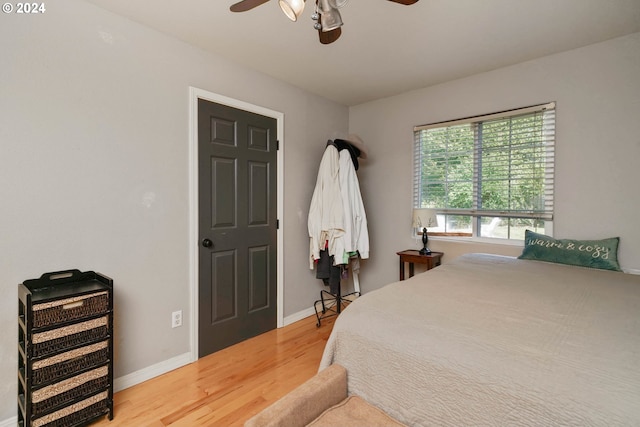 bedroom with ceiling fan and hardwood / wood-style floors