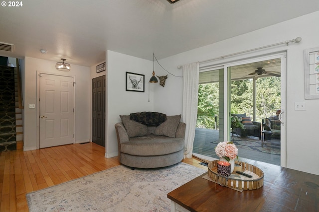 living room with ceiling fan and hardwood / wood-style floors