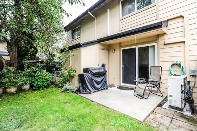 back of house with a patio and a yard