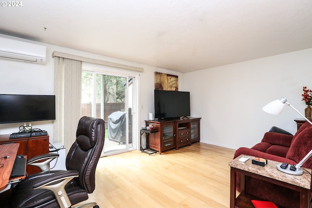 office area featuring a wall unit AC and hardwood / wood-style floors