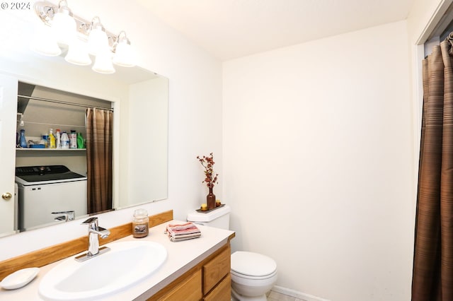 bathroom featuring washer / clothes dryer, vanity, and toilet