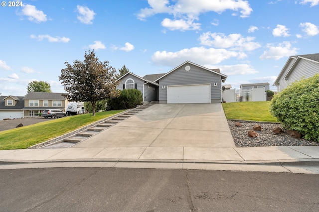 view of front of property with a garage and a front yard