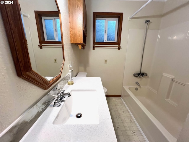 full bathroom with toilet, vanity, and bathing tub / shower combination