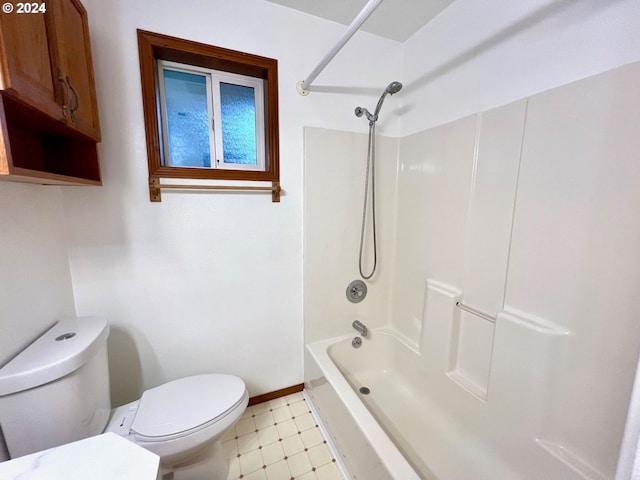 bathroom with toilet and bathtub / shower combination