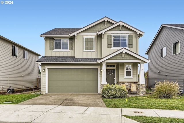 craftsman house with covered porch, a shingled roof, concrete driveway, a garage, and board and batten siding