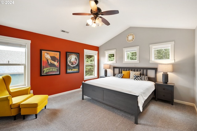 carpeted bedroom featuring ceiling fan and vaulted ceiling