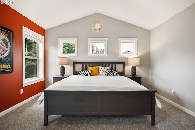 carpeted bedroom with vaulted ceiling