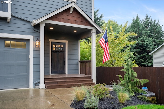 view of exterior entry with a garage