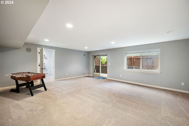 game room with light colored carpet