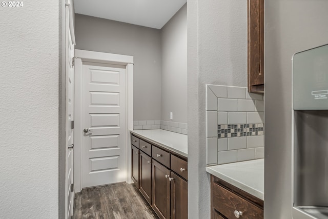 interior space featuring dark hardwood / wood-style floors and dark brown cabinetry